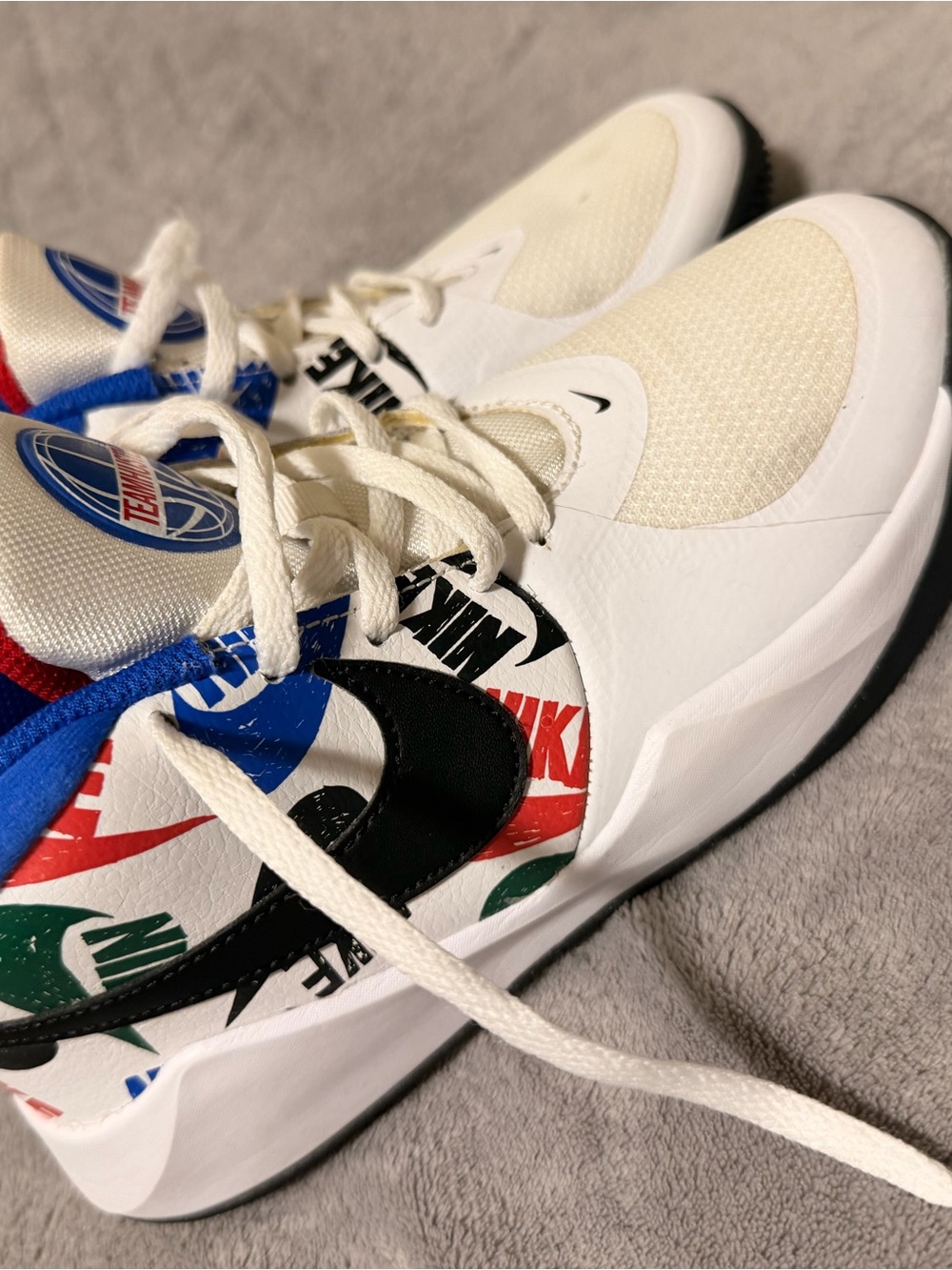Nike Kids White Basketball Sneakers with Black Swoosh & Multicolor Logo Accents